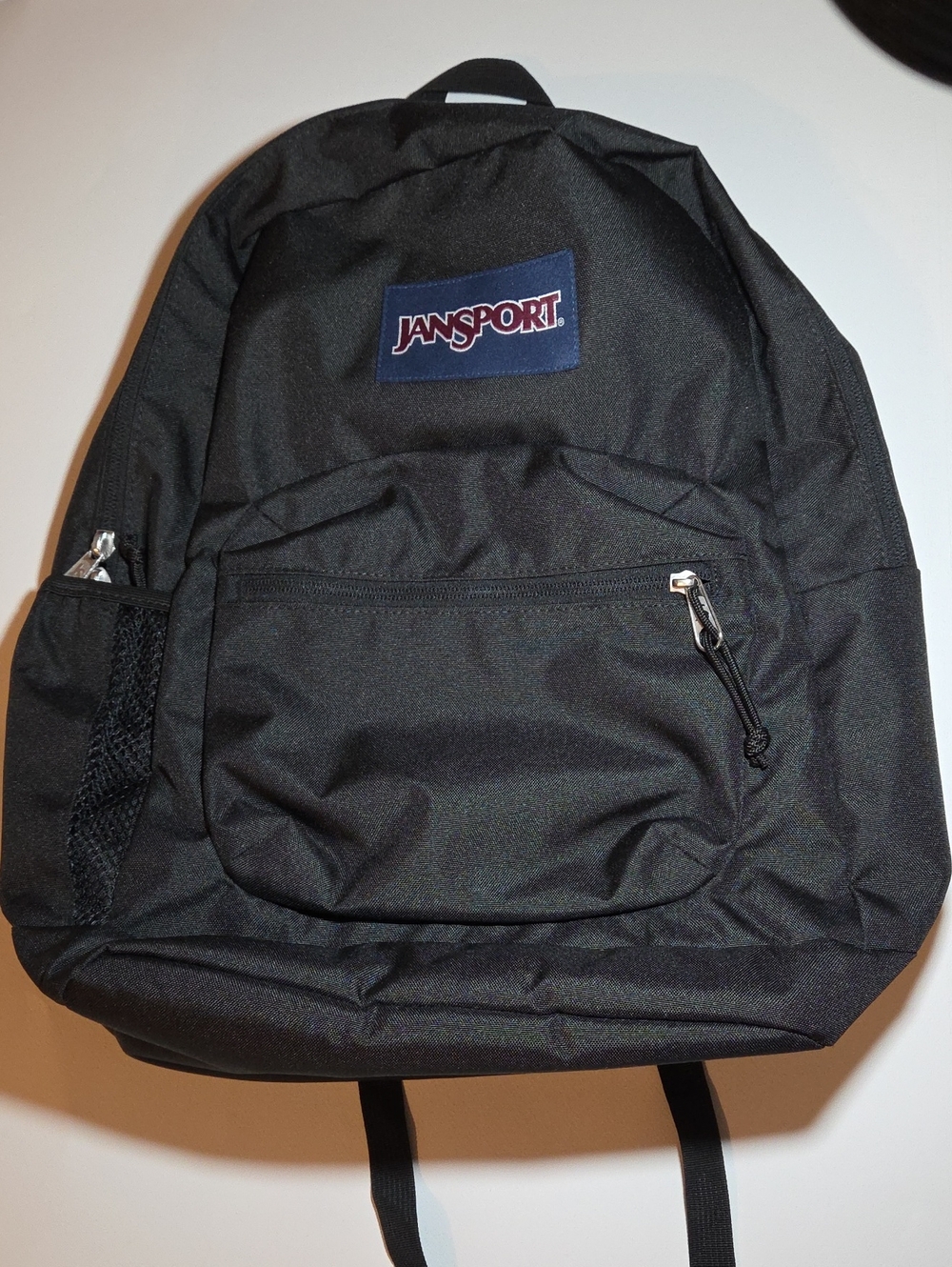 Like New Jansport Black Backpack with Navy Logo Patch